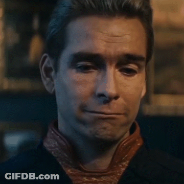 A Close Up Of A Man 'S Face Making A Funny Face . GIF