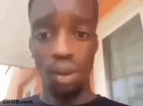 A Close Up Of A Man 'S Face Making A Funny Face While Looking At The Camera . GIF