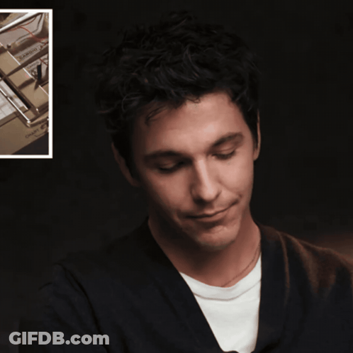 A Close Up Of A Man 'S Face Next To A Picture Of A Machine That Says ' Owc ' On It GIF