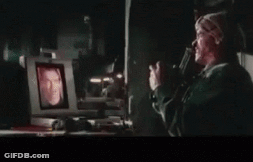 A Close Up Of A Man 'S Face On A TV Screen . GIF