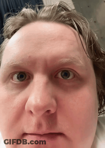 A Close Up Of A Man 'S Face Shows His Eyes GIF