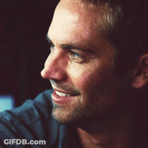 A Close Up Of A Man 'S Face Smiling GIF