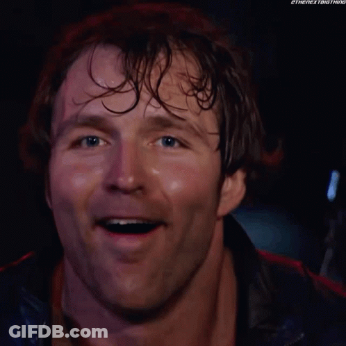 A Close Up Of A Man 'S Face Smiling With His Mouth Open . GIF