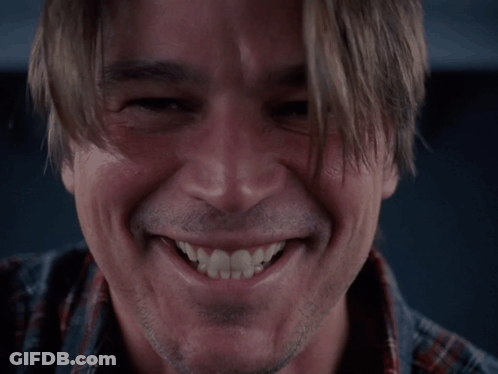 A Close Up Of A Man 'S Face Smiling GIF