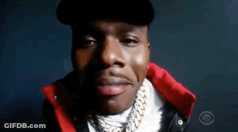 A Close Up Of A Man 'S Face Wearing A Hat And A Red Jacket . GIF