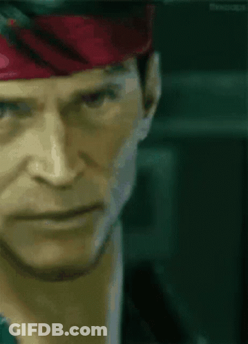 A Close Up Of A Man 'S Face Wearing A Red Headband GIF