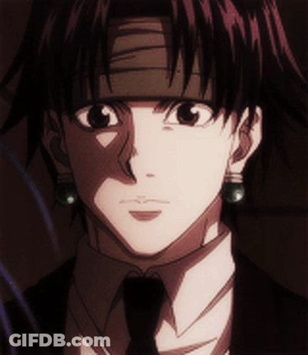A Close Up Of A Man 'S Face Wearing A Suit And Tie GIF