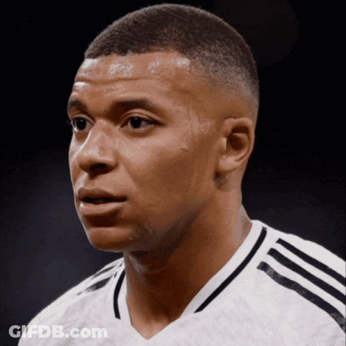 A Close Up Of A Man 'S Face Wearing A White Adidas Shirt GIF