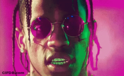 A Close Up Of A Man 'S Face Wearing Sunglasses And Dreadlocks . GIF