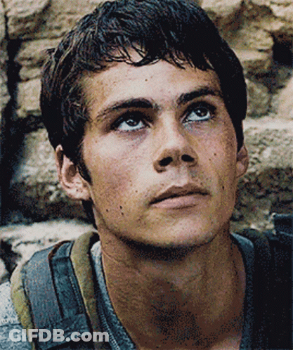 A Close Up Of A Man 'S Face With A Backpack On GIF