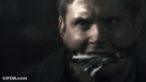 A Close Up Of A Man 'S Face With A Bandage On His Mouth GIF
