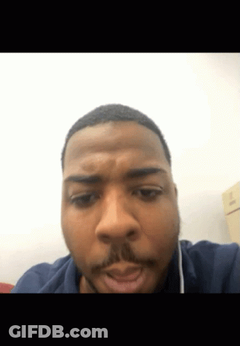 A Close Up Of A Man 'S Face With A Beard GIF