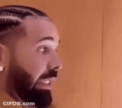 A Close Up Of A Man 'S Face With A Beard . GIF