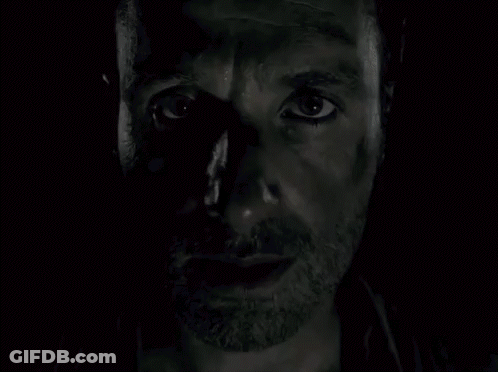 A Close Up Of A Man 'S Face With A Beard And A Black Eye . GIF