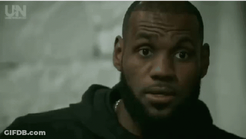 A Close Up Of A Man 'S Face With A Beard And A Black Hoodie . GIF