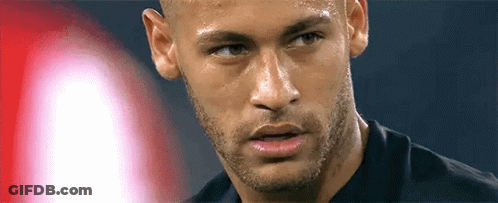 A Close Up Of A Man 'S Face With A Beard And A Black Shirt On . GIF
