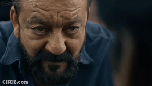 A Close Up Of A Man 'S Face With A Beard And A Blue Shirt With A Watermark That Says @Sanjeev GIF