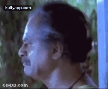 A Close Up Of A Man 'S Face With A Beard And A Mustache . GIF
