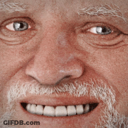A Close Up Of A Man 'S Face With A Beard And A Smile GIF