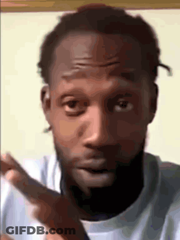 A Close Up Of A Man 'S Face With A Beard And A White Shirt GIF