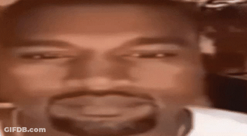 A Close Up Of A Man 'S Face With A Beard And A White Shirt . GIF