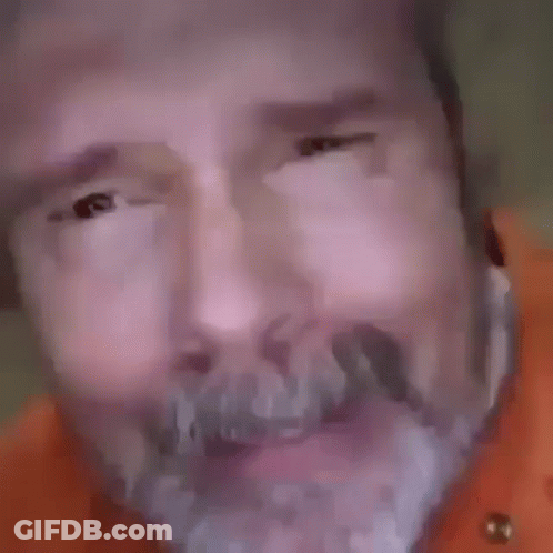 Close Up Of Man's Face With Beard And Big Eyes GIF