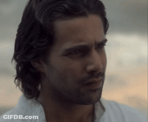 A Close Up Of A Man 'S Face With A Beard And Long Hair GIF