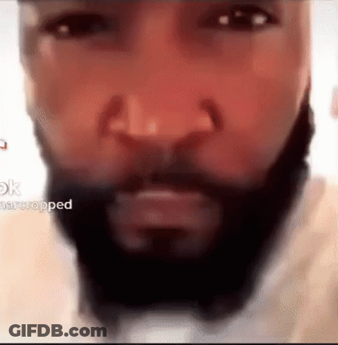 A Close Up Of A Man 'S Face With A Beard And Mustache . GIF