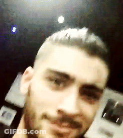 A Close Up Of A Man 'S Face With A Beard And Short Hair GIF