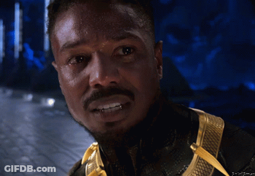 A Close Up Of A Man 'S Face With A Beard And Teeth GIF