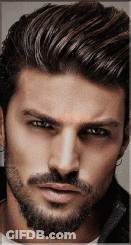 A Close Up Of A Man 'S Face With A Beard And The Name Vince On The Bottom GIF