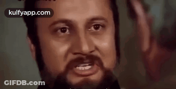 A Close Up Of A Man 'S Face With A Beard And The Words Kulfyapp.com In The Corner GIF