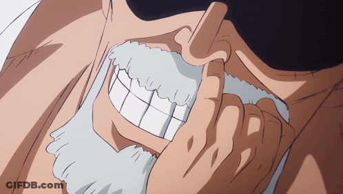 A Close Up Of A Man 'S Face With A Beard And White Teeth GIF