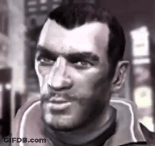 A Close Up Of A Man 'S Face With A Beard In A Black And White Photo . GIF
