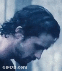 A Close Up Of A Man 'S Face With A Beard . GIF