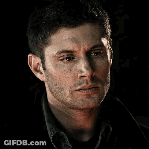 A Close Up Of A Man 'S Face With A Beard Looking At The Camera . GIF