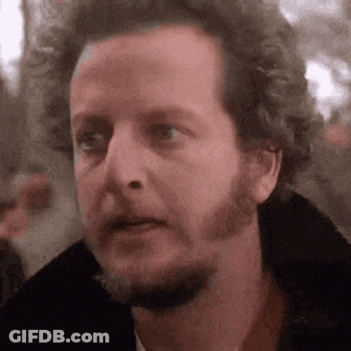 A Close Up Of A Man 'S Face With A Beard Making A Funny Face . GIF