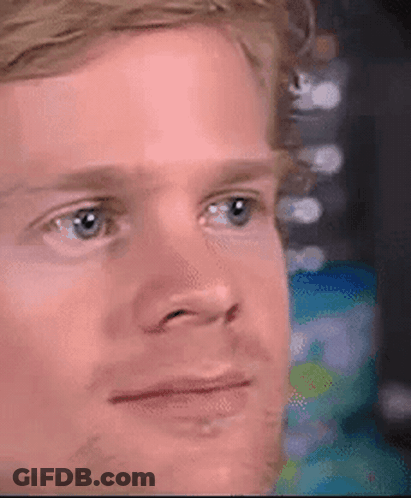 A Close Up Of A Man 'S Face With A Beard Making A Funny Face . GIF