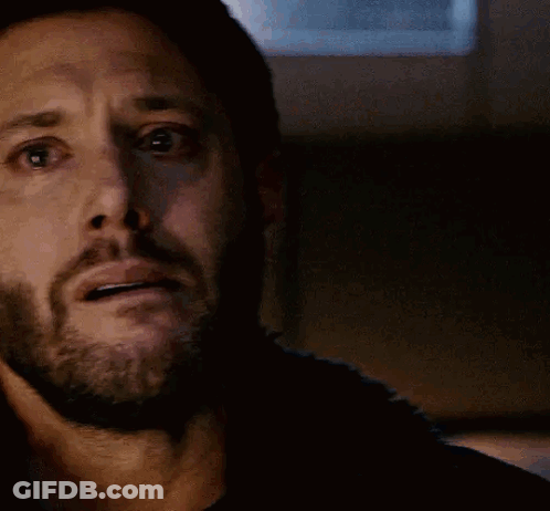 A Close Up Of A Man 'S Face With A Beard Making A Surprised Face . GIF