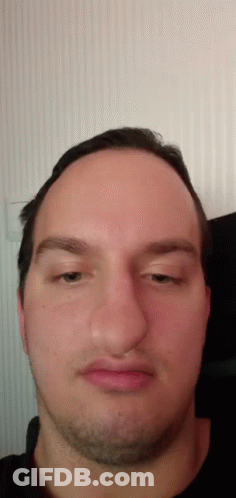 A Close Up Of A Man 'S Face With A Beard GIF