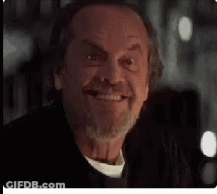 A Close Up Of A Man 'S Face With A Beard Smiling . GIF