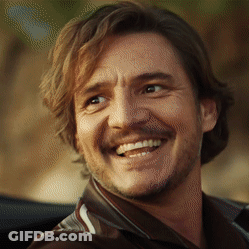 A Close Up Of A Man 'S Face With A Beard Smiling GIF