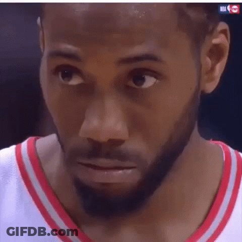 A Close Up Of A Man 'S Face With A Beard Wearing A Red And White Jersey . GIF