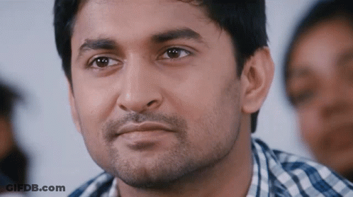 A Close Up Of A Man 'S Face With A Beard GIF