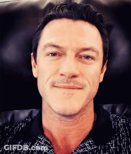 A Close Up Of A Man 'S Face With A Beard GIF