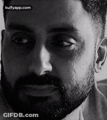 A Close Up Of A Man 'S Face With A Beard . GIF