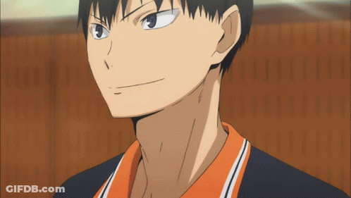 A Close Up Of A Man 'S Face With A Black And Orange Shirt GIF