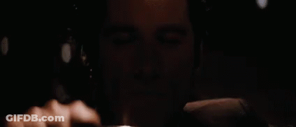 A Close Up Of A Man 'S Face With A Black Background GIF