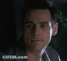 A Close Up Of A Man 'S Face With A Black Background GIF