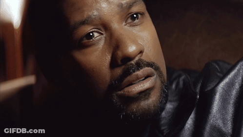 A Close Up Of A Man 'S Face With A Black Jacket On GIF